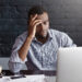 Overworked concentrated young African-American