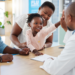 A young girl at the doctor with her mother and father, representing the benefits of managed care organizations